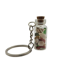 Porte-clés fiole "Mille et un trésors" avec corail corse véritable et plusieurs yeux de Sainte-Lucie. Création artisanale corse.