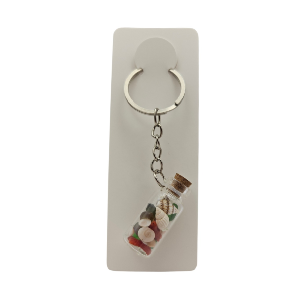 Porte-clés fiole "Mille et un trésors" avec corail corse véritable et plusieurs yeux de Sainte-Lucie. Création artisanale corse.
