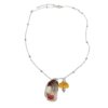 Pièce unique. Collier fait main. Véritable œil de Sainte-Lucie, corail corse et verre polis.
Création artisanale corse.