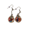 Pièces uniques. Boucles d'oreilles faites main. Corail corse véritable, œil de Sainte-Lucie et verres polis.
Création artisanale corse.